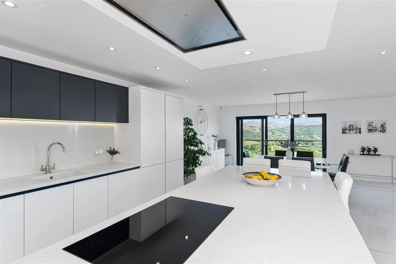 Dining area framed by full-height windows