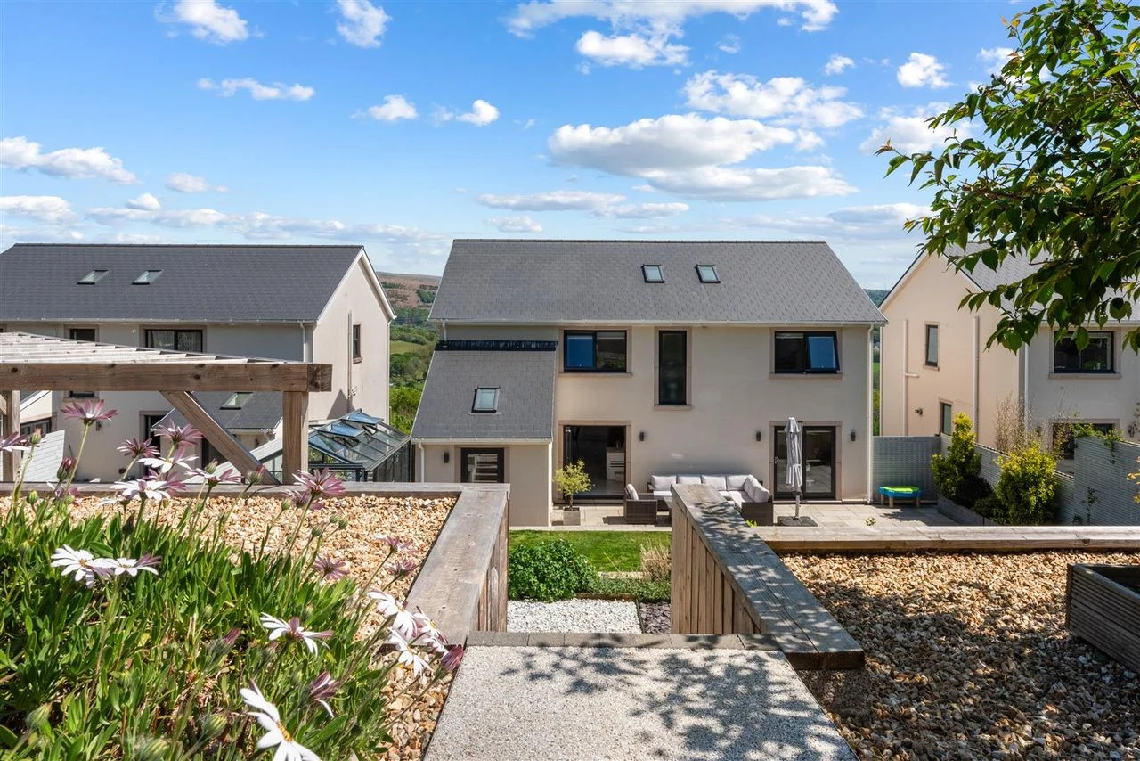 Rear of the house with landscaped garden backing onto open farmland
